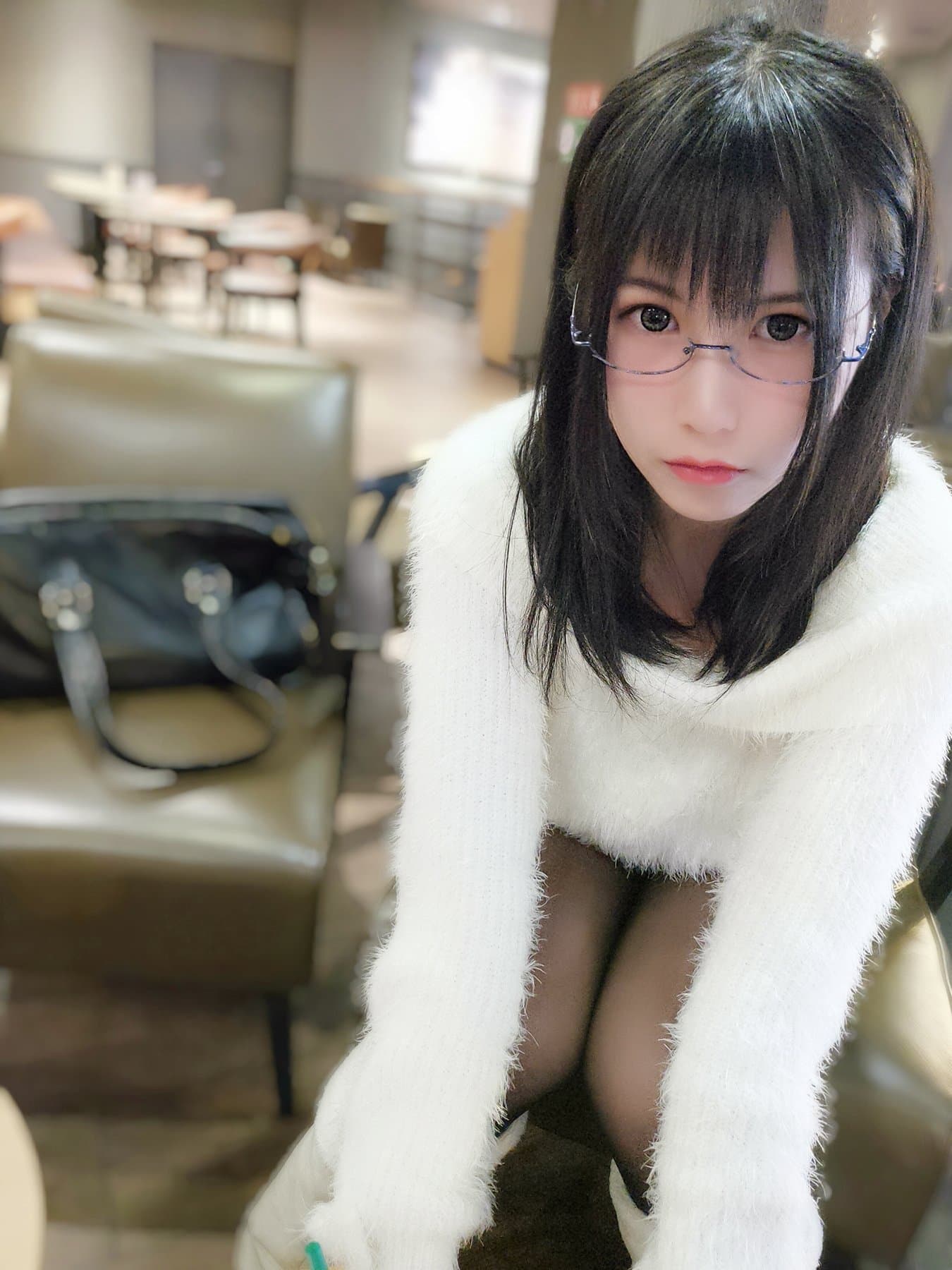 Bare feet, white sweater